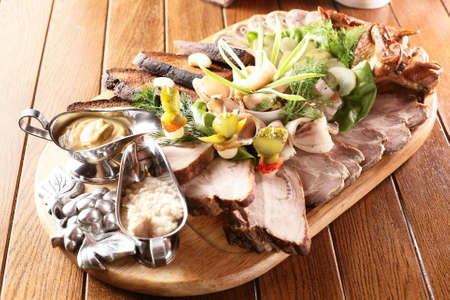 fresh and tasty peaces of meat with garnishの写真素材