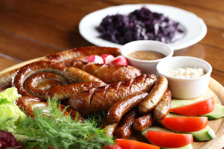 fresh and tasty peaces of meat with garnishの写真素材