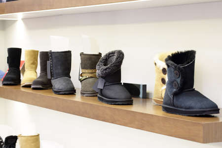 bright and fashionable interior of shoe store in modern mallの写真素材