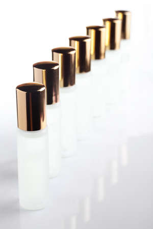 little transparent and cute parfume bottle on white backgroundの写真素材