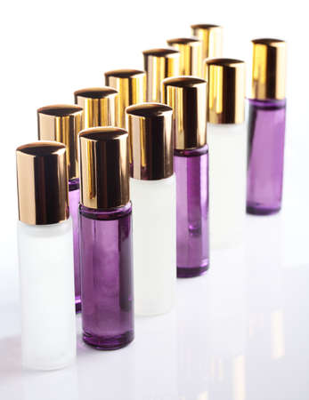 little transparent and cute parfume bottle on white backgroundの写真素材