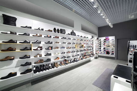 bright and fashionable interior of shoe store in modern mall