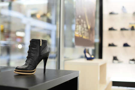 bright and fashionable interior of shoe store in modern mallの写真素材