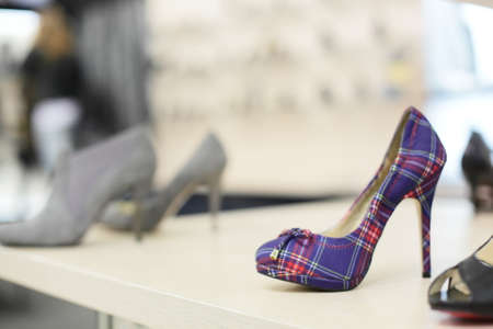 bright and fashionable interior of shoe store in modern mallの写真素材