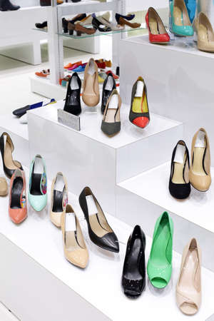 bright and fashionable interior of shoe store in modern mallの写真素材