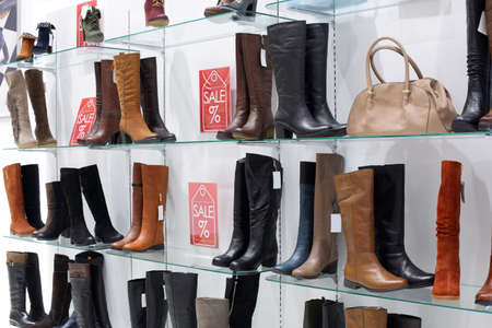 bright and fashionable interior of shoe store in modern mallの写真素材