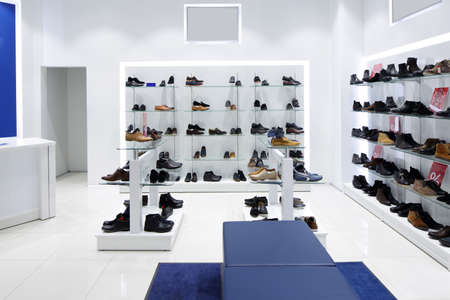 bright and fashionable interior of shoe store in modern mallの写真素材