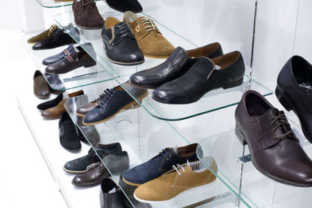 bright and fashionable interior of shoe store in modern mall