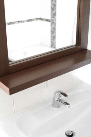 bright interior of brand new bathroom with mirror