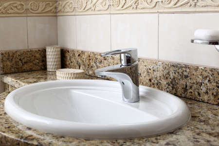 luxury modern white sink in stone interiorの写真素材