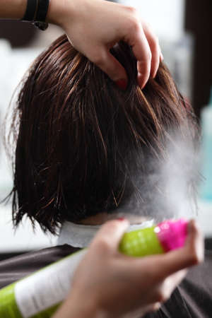 hair care of young european girl in beauty salonの写真素材