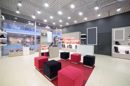 bright and fashionable interior of shoe store in modern mallの写真素材