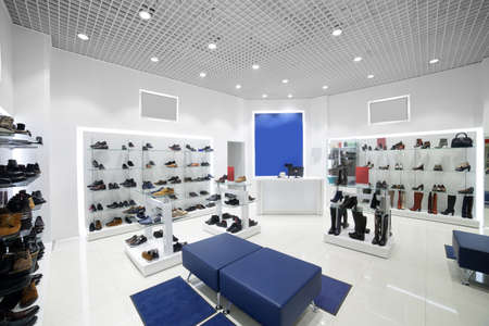 bright and fashionable interior of shoe store in modern mallの写真素材