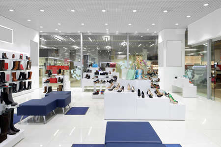 bright and fashionable interior of shoe store in modern mallの写真素材
