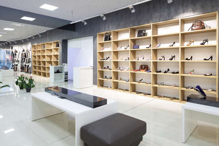 bright and fashionable interior of shoe store in modern mallの写真素材