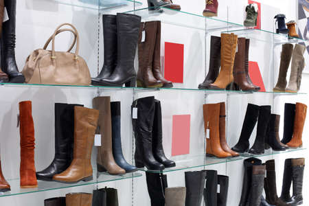 bright and fashionable interior of shoe store in modern mallの写真素材
