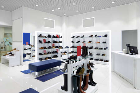 bright and fashionable interior of shoe store in modern mallの写真素材