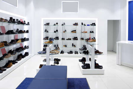 bright and fashionable interior of shoe store in modern mallの写真素材