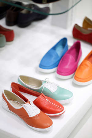 bright and fashionable interior of shoe store in modern mallの写真素材