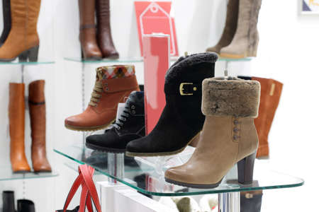 bright and fashionable interior of shoe store in modern mallの写真素材