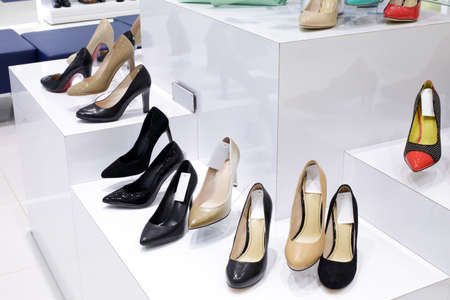 bright and fashionable interior of shoe store in modern mallの写真素材