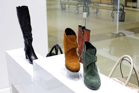 bright and fashionable interior of shoe store in modern mallの写真素材