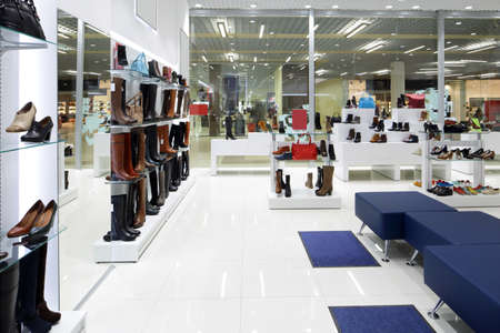 bright and fashionable interior of shoe store in modern mallの写真素材