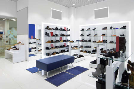 bright and fashionable interior of shoe store in modern mallの写真素材