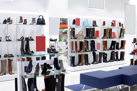 bright and fashionable interior of shoe store in modern mallの写真素材