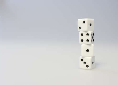 A stack of four dice in an neutral environment.の写真素材