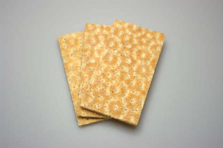 Three pieces of crispbread lying on top of each other.の写真素材