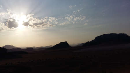 Sun behind clouds at Wadi-Rumの写真素材