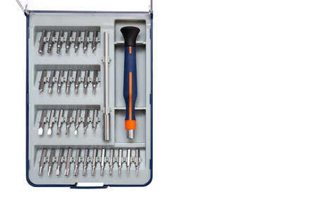 Screwdriver with a set of bits on a white background. There is a place for advertising text.