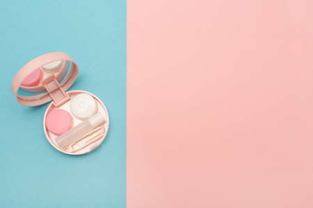Travel kit for contact lenses. Pink color. Care and hygiene for colored contact lenses. Copy space. Text.の写真素材