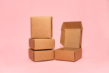 Self-gathering cardboard box. Delivery, moving, gift wrapping on a colored background. Place for text and logo. Brown.の写真素材