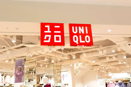Moscow, Russia - October 2, 2021. Uniqlo store in Vegas mall. Close-up logo. Japanese casual clothing retail chain.のeditorial素材