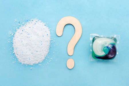 Choice between washing powder and laundry capsule. Liquid laundry detergent capsule. Wooden question...