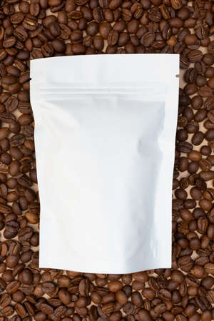 Blank foil plastic paper coffee bag in white color. Place for your text. Copy space. Background of...