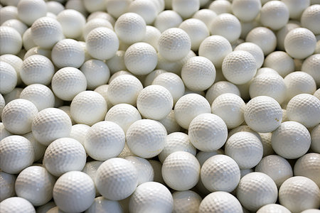 Close-Up of a Plethora of Golf Balls. Mesmerizing Texture of Numerous Spherical Objectsの素材