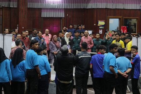 Unidentified people gathered in a room.の写真素材