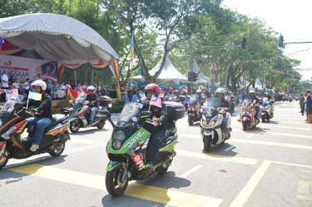 GEORGE TOWN, MALAYSIA - AUGUST 31, 2016 : Student waving Malaysia flag also known as Jalur Gemilang on Independence Day celebration or Merdeka Day.のeditorial素材