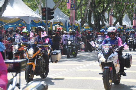 GEORGE TOWN, MALAYSIA - AUGUST 31, 2016 : Student waving Malaysia flag also known as Jalur Gemilang on Independence Day celebration or Merdeka Day.のeditorial素材
