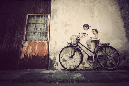 mural painting kids ride a bicycleの素材