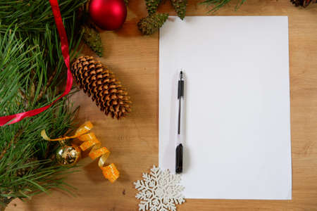 Christmas Decorations Mockup on Wood Table Top View. Concept of goals and plans for the next year. Copy spaceの写真素材