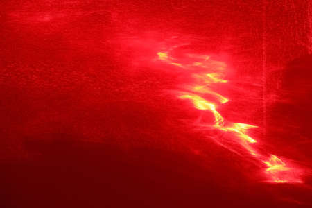 A beautiful photophone painted with a red laser as a result of light refraction.の写真素材