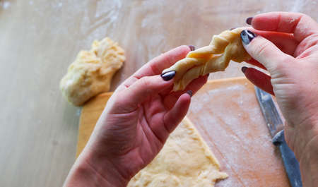 Homemade bread baking. Closeup woman hands kneading The Dough. Beautiful, cook.