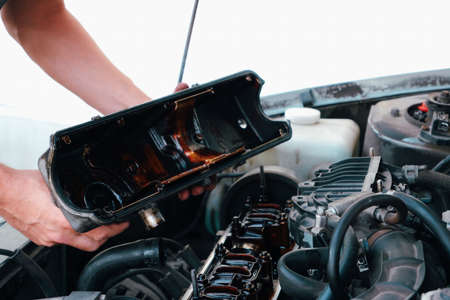 Car repair. Internal combustion engine repair. Deposits of tar from low-quality oil on the engine timing mechanism.の写真素材