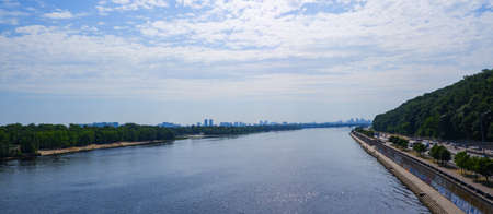 Scenery. View of a deep river in the middle of a big city. Embankment, beaches and urban development...