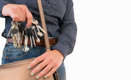 Young beautiful woman holding a bunch of keys