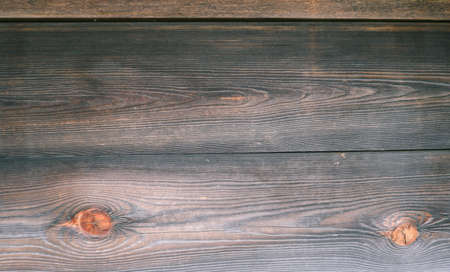 The surface of an old wooden slab house. Old slab texture. Close up Wooden planks texture...